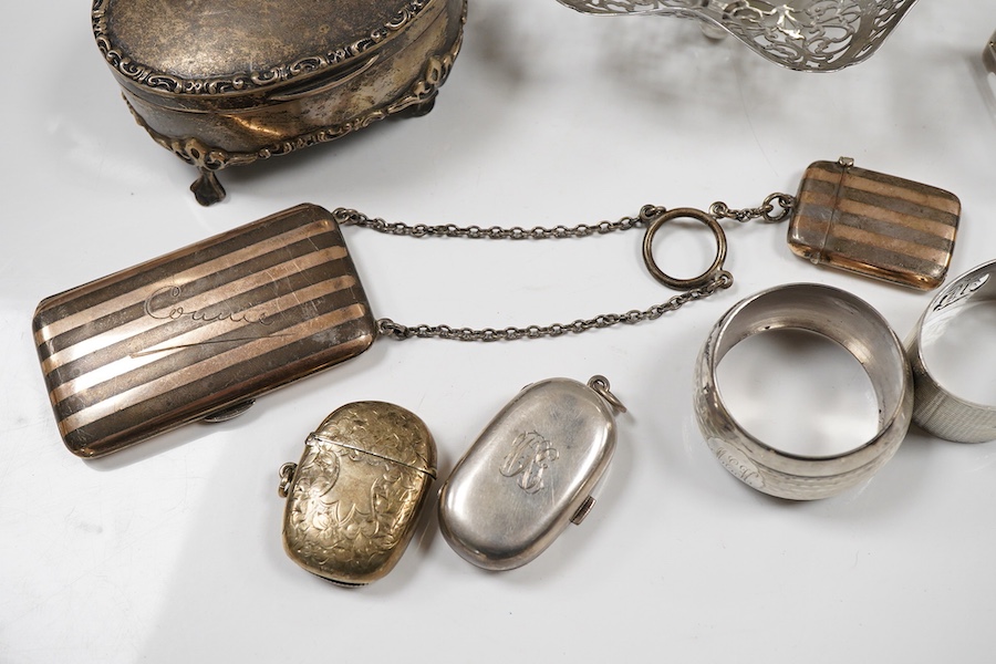Sundry small silver including an Edwardian oval tea caddy, Hasseler Brothers, London, 1901, 10.4cm, a pierced bonbon dish, a late Victorian cream jug, five napkin rings including two pairs, a seven bar toast rack, a dama
